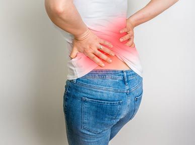 Image of a woman suffering from back pain