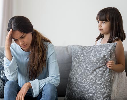 Little girl watching her mom in pain